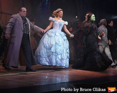 Michael McCormick as "The Wizard", Brittney Johnson as "Glinda", Lindsay Pearce as "E Photo
