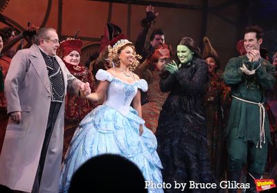 Michael McCormick as "The Wizard", Brittney Johnson as "Glinda", Lindsay Pearce as "E Photo