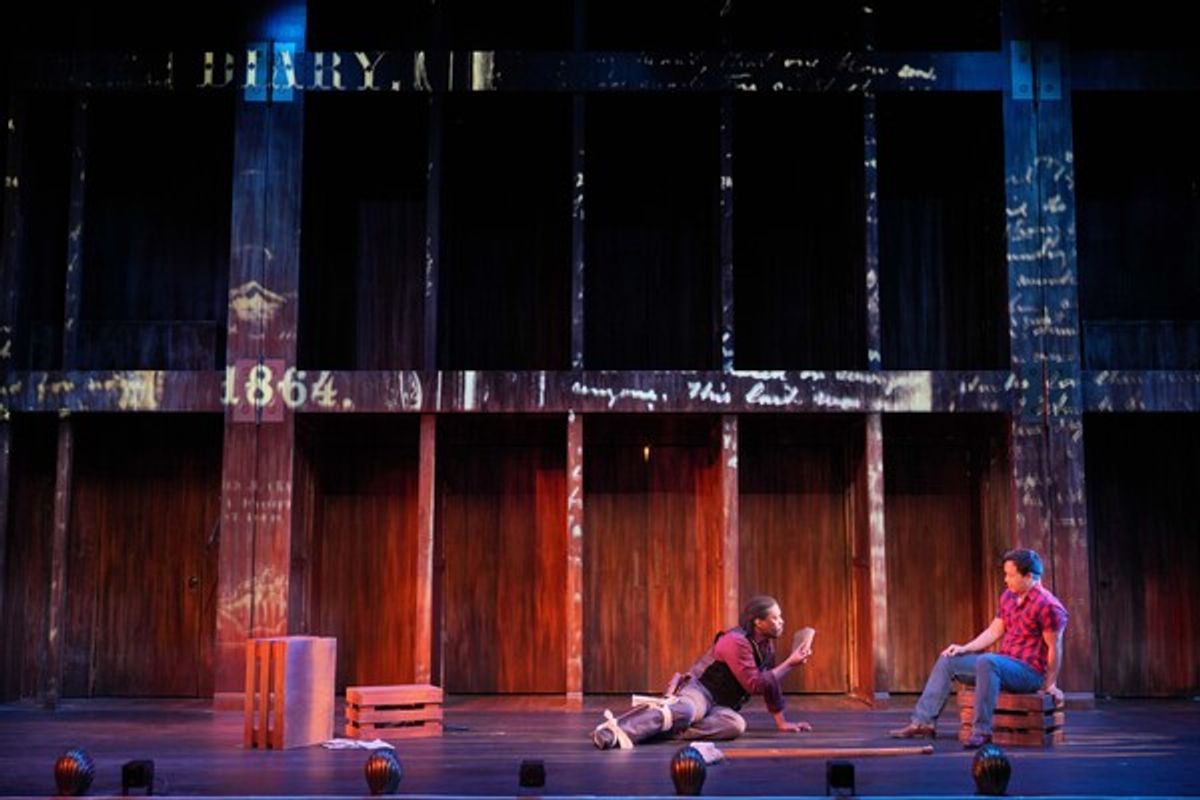 Thance Thompson (L) as John Wilkes Booth and Adam Kaokept (R) as the Balladeer at 