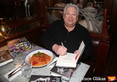 NEW YORK, NEW YORK - MARCH 01: Harvey Fierstein signs books at a dinner celebration f Photo