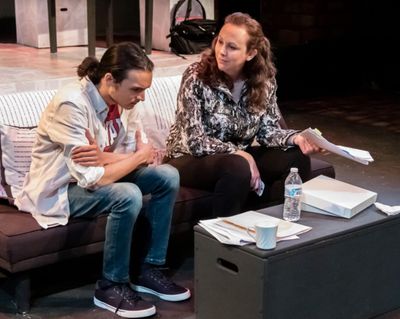Editor Emily (Krista Schafer Ewbank) lands a point against the fact checker (David Li Photo