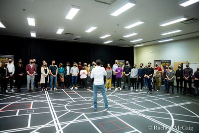 The Associate Director welcoming the cast, crew and media to the first day of  rehear Photo