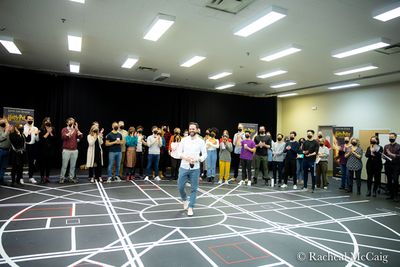 The Associate Director welcoming the cast, crew and media to the first day of  rehear Photo