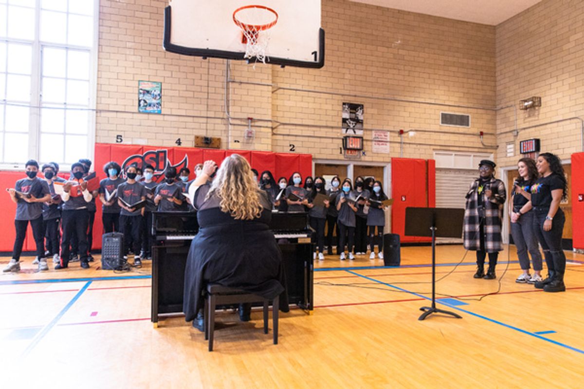Q252 Queens School of Inquiry Choir, Julia Schade (SIX Musical Director/Conductor/Keyboard) at the piano that SIX donated to the school, Keirsten Nicole Hodgens (SIX cast member), Hana Stewart (SIX cast member), Nicole Kyoung-Mi Lambert (SIX cast member) at 