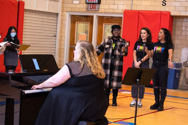 Julia Schade (SIX Musical Director/Conductor/Keyboard) at the piano that SIX donated  Photo