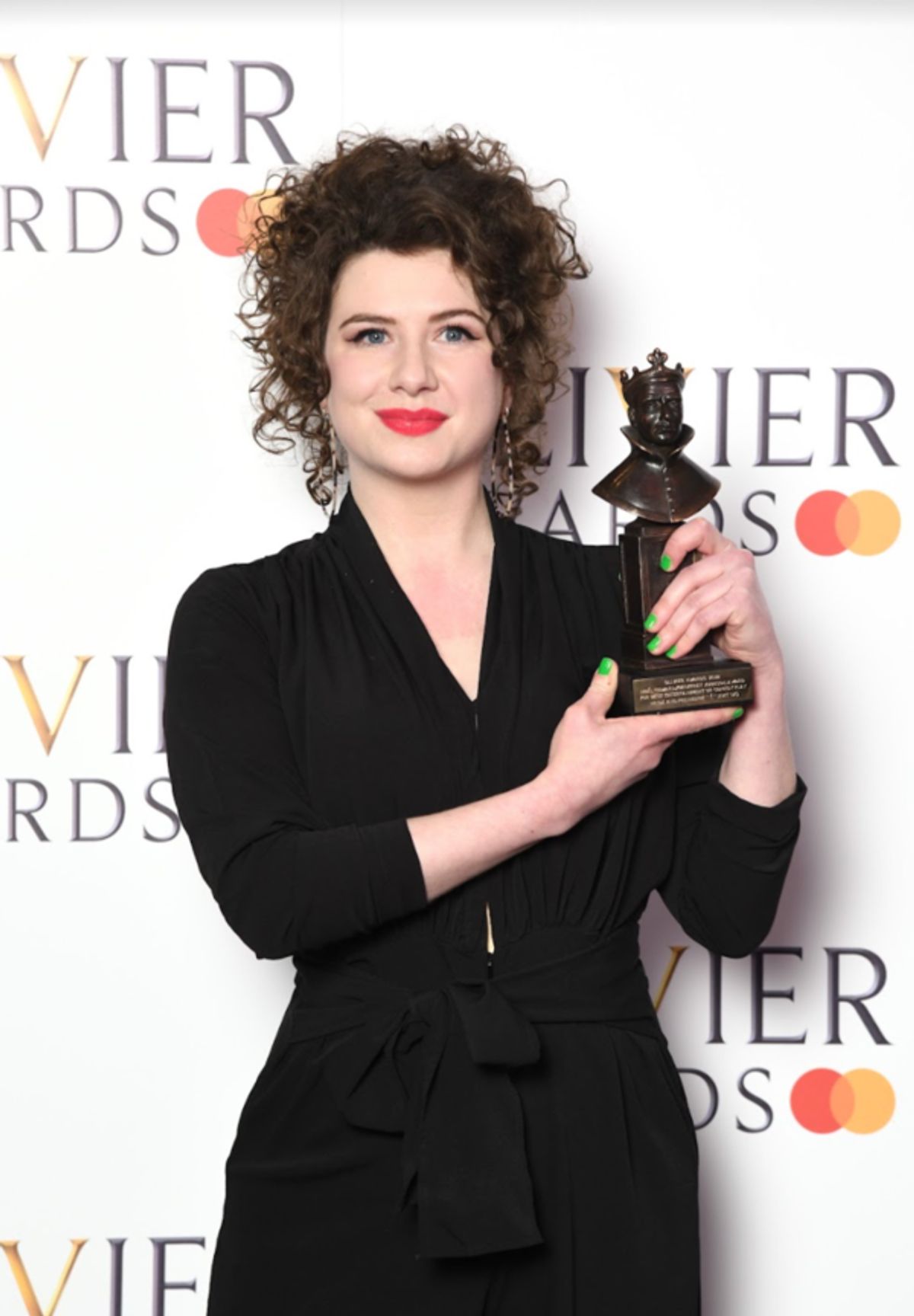 Isobel McArthur, creator and director of Pride and Prejudice (Sort Of) with her Olivier Award for Best Entertainment or Comedy Play. 
Photo Credits: Gareth Cattermole for Getty.  at 