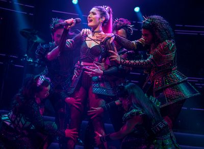 Didi Romero as Katherine Howard (center) in The North American Tour Aragon Company of Photo