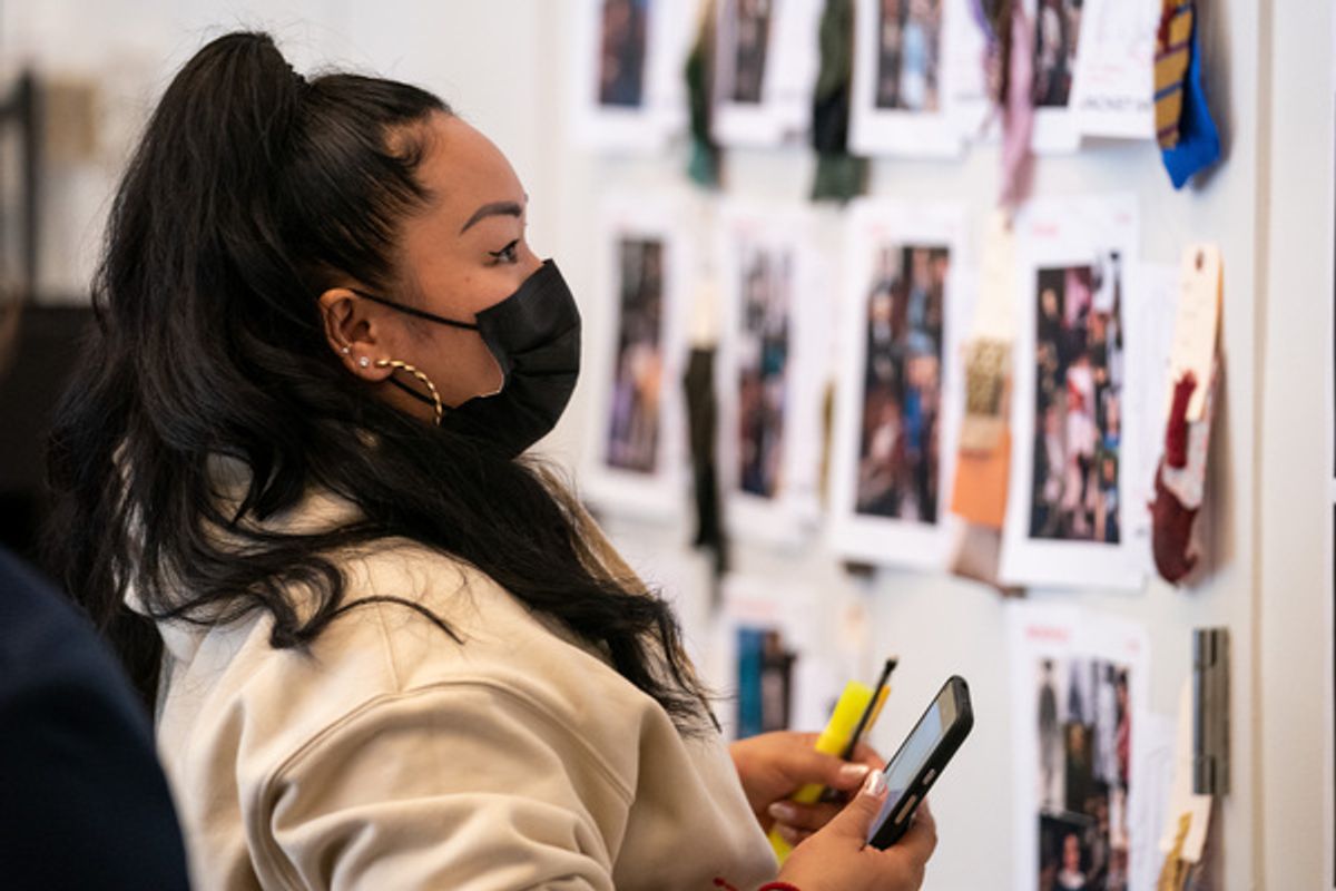 Sara Porkalob views costume designs by Emilio Sosa for 1776 at 