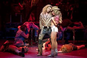 Josh Scholl (left) plays Stacee Jaxx and Taylor DiTola plays Sherrie in Rock of Ages Photo