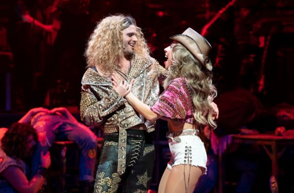 Josh Scholl (left) plays Stacee Jaxx and Taylor DiTola plays Sherrie in Rock of Ages Photo