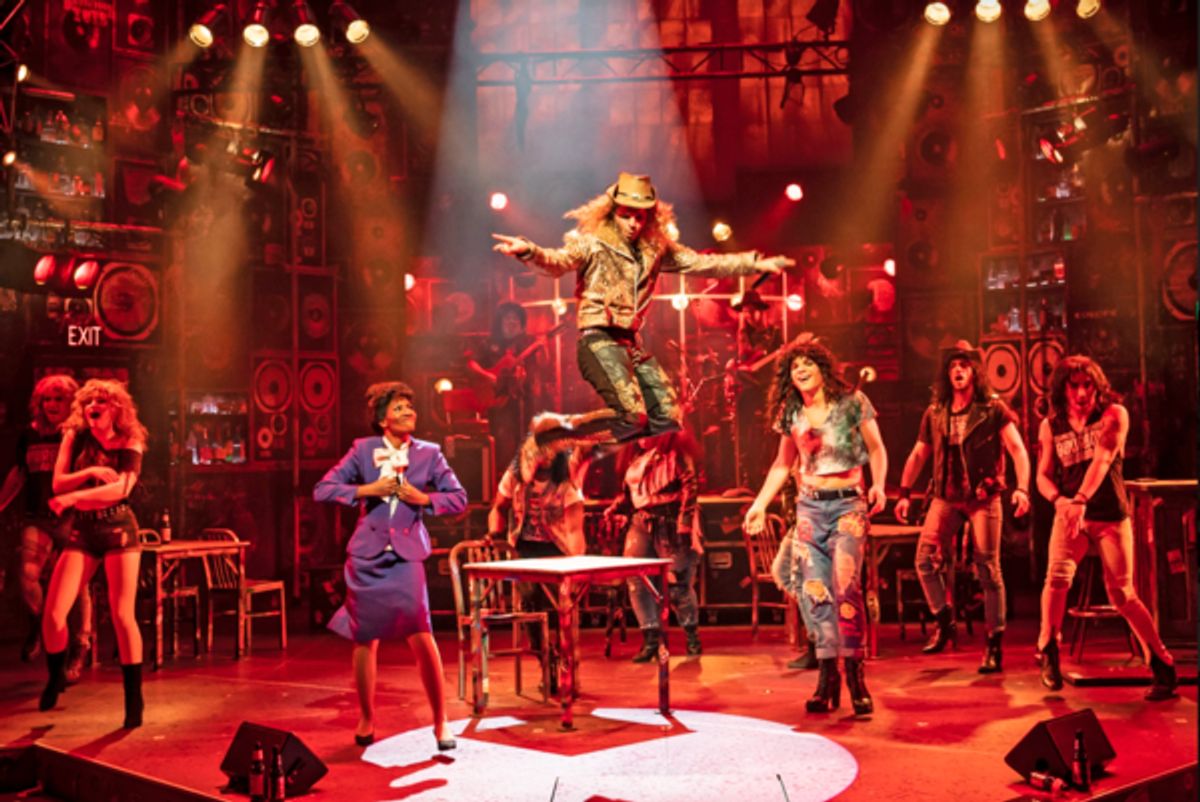 Josh Scholl (center) plays Stacee Jaxx in Rock of Ages at Photos: First Look at Paramount Theatre's ROCK OF AGES