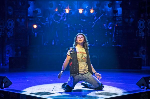 Kieran McCabe (center) plays Drew in Rock of Ages Photo
