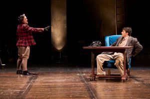 The Professor (actor, Maggie Kettering*) reveals his true nature to Hannay (actor, Anthony Michael Martinez*) in the Great Lakes Theater production of Alfred Hitchcock’s at the Hanna Theatre, Playhouse Square running through May 22. (Photo by Roger Mastroianni) @ BroadwayWorld The Professor (actor, Maggie Kettering*) reveals his true nature to Hannay (actor, An Photo