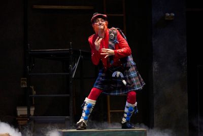 The innkeeper (actor, Joe Wegner*) entertains his guests in the Great Lakes Theater p Photo