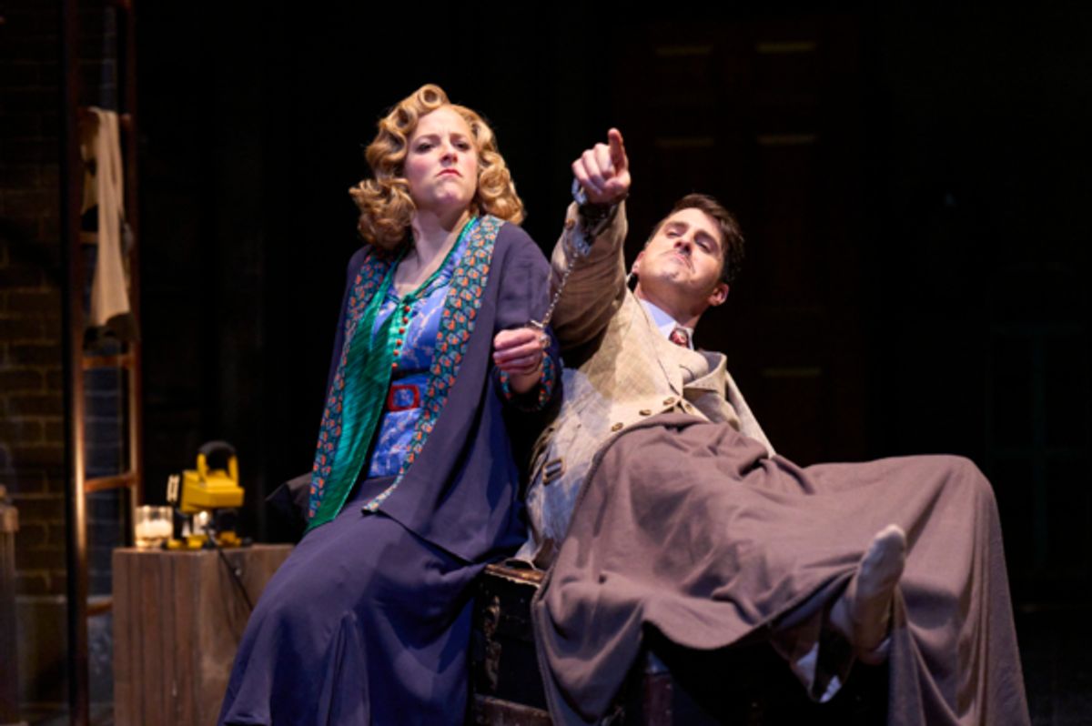 Pamela (actor, Betsy Mugavero*) and Hannay (actor, Anthony Michael Martinez*) prepare for an uncomfortable evening in the Great Lakes Theater production of Alfred Hitchcock’s THE 39 STEPS at the Hanna Theatre, Playhouse Square running through May 22. (Photo by Roger Mastroianni) at 