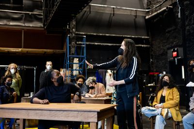 Diane Paulus (standing) with company members  Photo