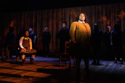 Tiffani Barbour (seated), Salome B. Smith (standing), and members of the company Photo