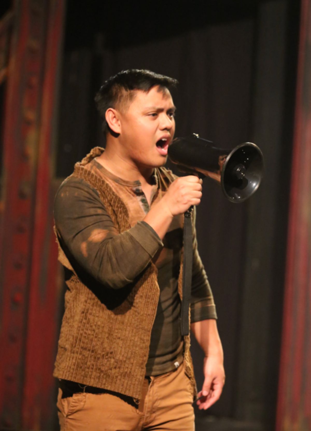 Bobby Strong (Kevin Corpuz) leads the rebellion in the Act I finale of New Line Theatre's URINETOWN, 2022. Photo credit: Jill Ritter Lindberg.
 at 