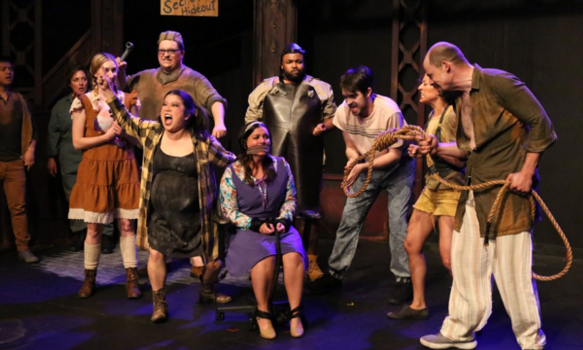 Little Becky Two Shoes (Grace Langford), Hot Blades Harry (Zachary Allen Farmer), and the Rebels sing 'Snuff That Girl' to the kidnapped Hope (Melissa Felps, tied-up) in New Line Theatre's URINETOWN, 2022. Photo credit: Jill Ritter Lindberg.
 at 