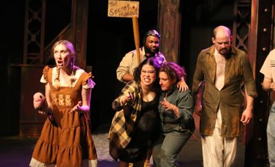 The Rebels in their secret hideout, in New Line Theatre's URINETOWN, 2022. Photo cred Photo
