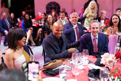 Stephanie Pinder-Amaker, Tommy Amaker, Bill Shutzer, and guests participate in the li Photo
