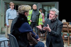 Alex Jennings with members of the company Photo