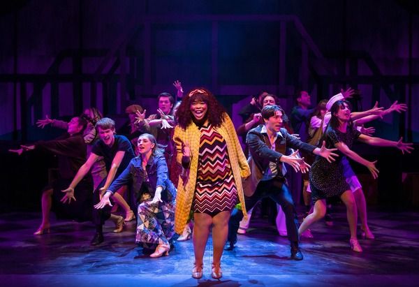 Dwan Hayes (center) with the company Photo