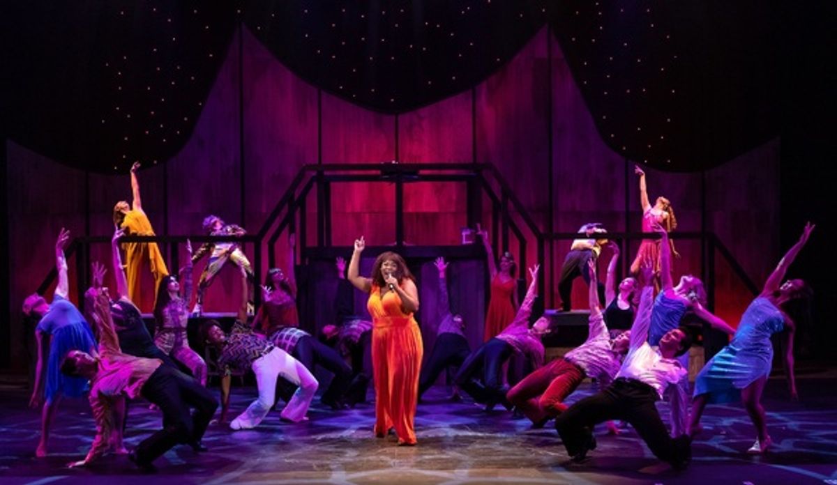 Dwan Hayes (center) with the company  at 