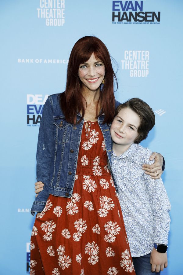 From left, actor Annie Wersching and her son Ozzie Wersching arrive for the opening n Photo