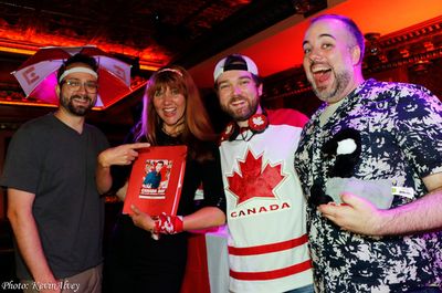 Joshua Stackhouse, with Canadian Trivia prize winners Photo