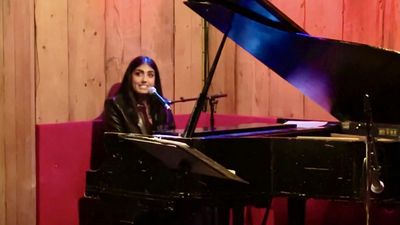 Petra Jarrar singing original song REBEL at THE VIOLET HOUR hosted by Mikayla Petrill Photo