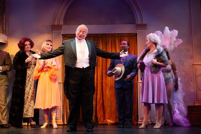 Dimitri Weissman (Louis Parnell*, center) welcomes his guests (L-R) Carlotta Campion  Photo