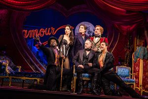Ashley Loren as Satine, Derek Klena as Christian, Eric Anderson as Harold Zidler; Seated " Sahr Ngaujah as Toulouse-Lautrec, Declan Bennett as The Duke of Monroth, Caleb Marshall Villarreal as Santiago
@ BroadwayWorld Ashley Loren as Satine, Derek Klena as Christian, Eric Anderson as Harold Zidler; Sea Photo
