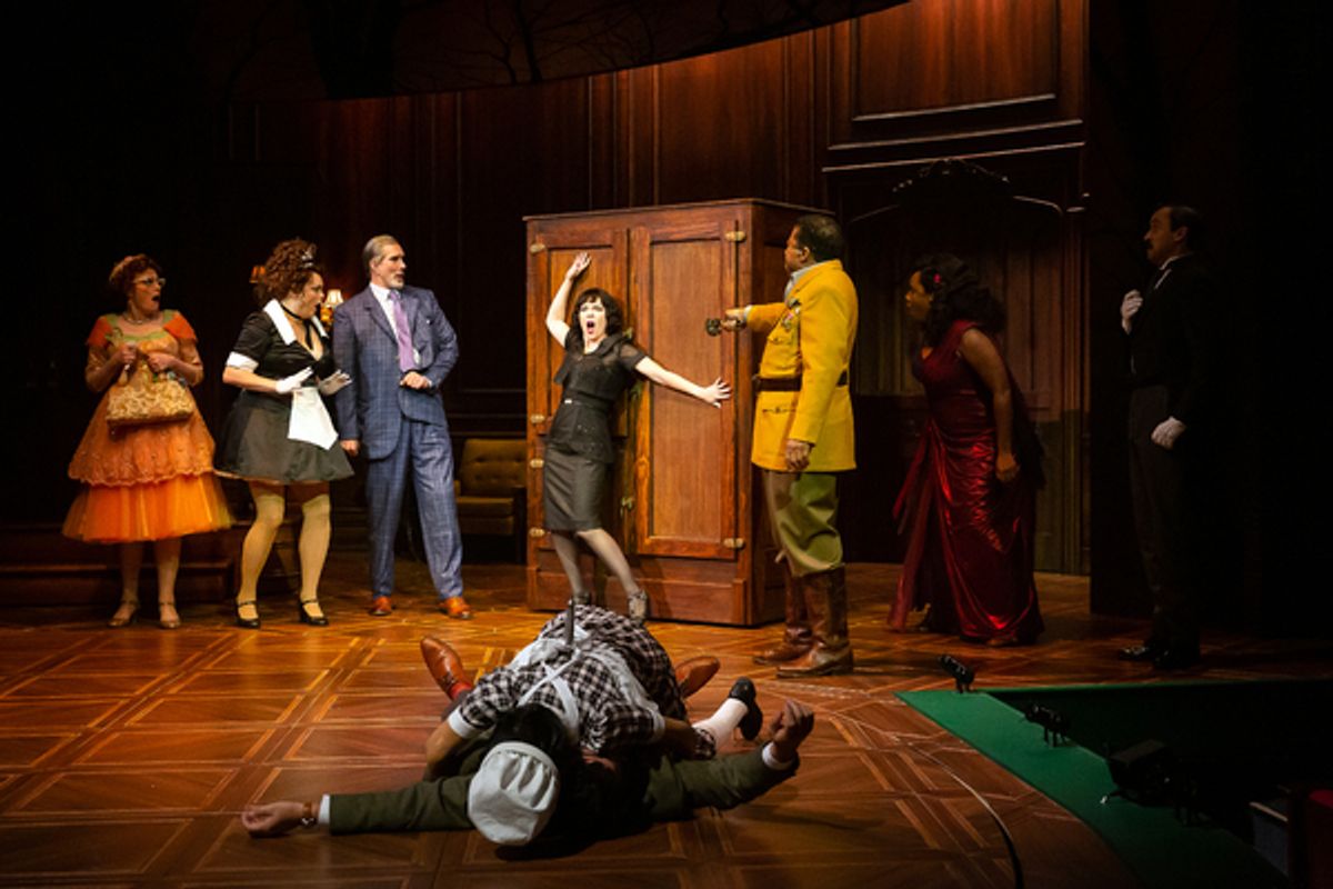 Susan Koozin as Mrs. Peacock, Melissa Pritchett as Yvette, Todd Waite as Professor Plum, Elizabeth Bunch as Mrs. White, David Rainey as Colonel Mustard, Michelle Elaine as Miss Scarlet, Dylan Godwin as Wadsworth, Melissa Molano as The Cook, and Chris Hutchison as Mr. Boddy  at 