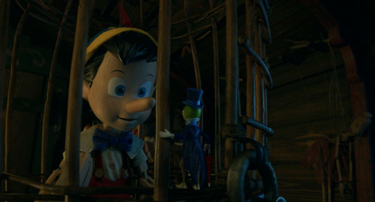 Pinocchio (voiced by Benjamin Evan Ainsworth) and Jiminy Cricket (voiced by Joseph Gordon-Levitt) in Disney's live-action PINOCCHIO at 