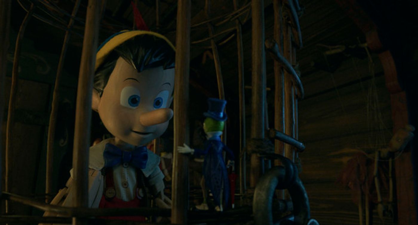 Pinocchio (voiced by Benjamin Evan Ainsworth) and Jiminy Cricket (voiced by Joseph Gordon-Levitt) in Disneys live-action PINOCCHIO
