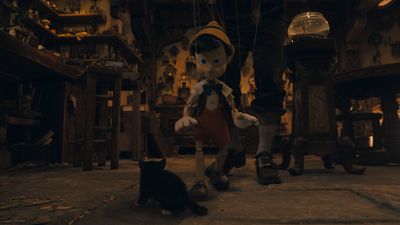 Figaro and Pinocchio (voiced by Benjamin Evan Ainsworth) in Disney's live-action PINO Photo