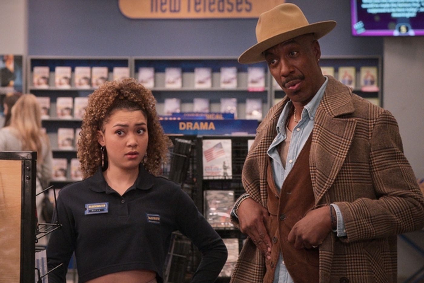 Kamaia Fairburn as Kayla, J.B. Smoove as Percy in episode 105 of Blockbuster