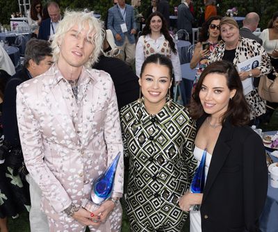 Machine Gun Kelly, Amber Midthunder, and Artist of Distinction award honoree Aubrey P Photo