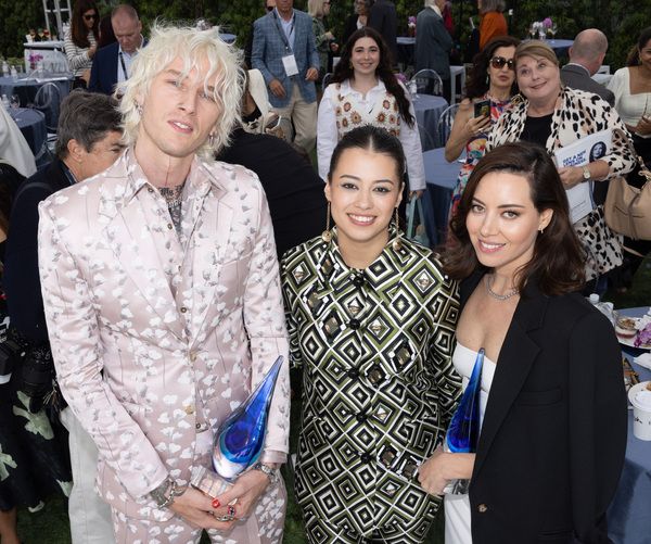 Machine Gun Kelly, Amber Midthunder, and Artist of Distinction award honoree Aubrey P Photo