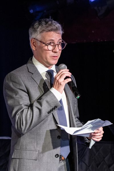 Tony Speciale offers a toast to Anne Bogart  Photo