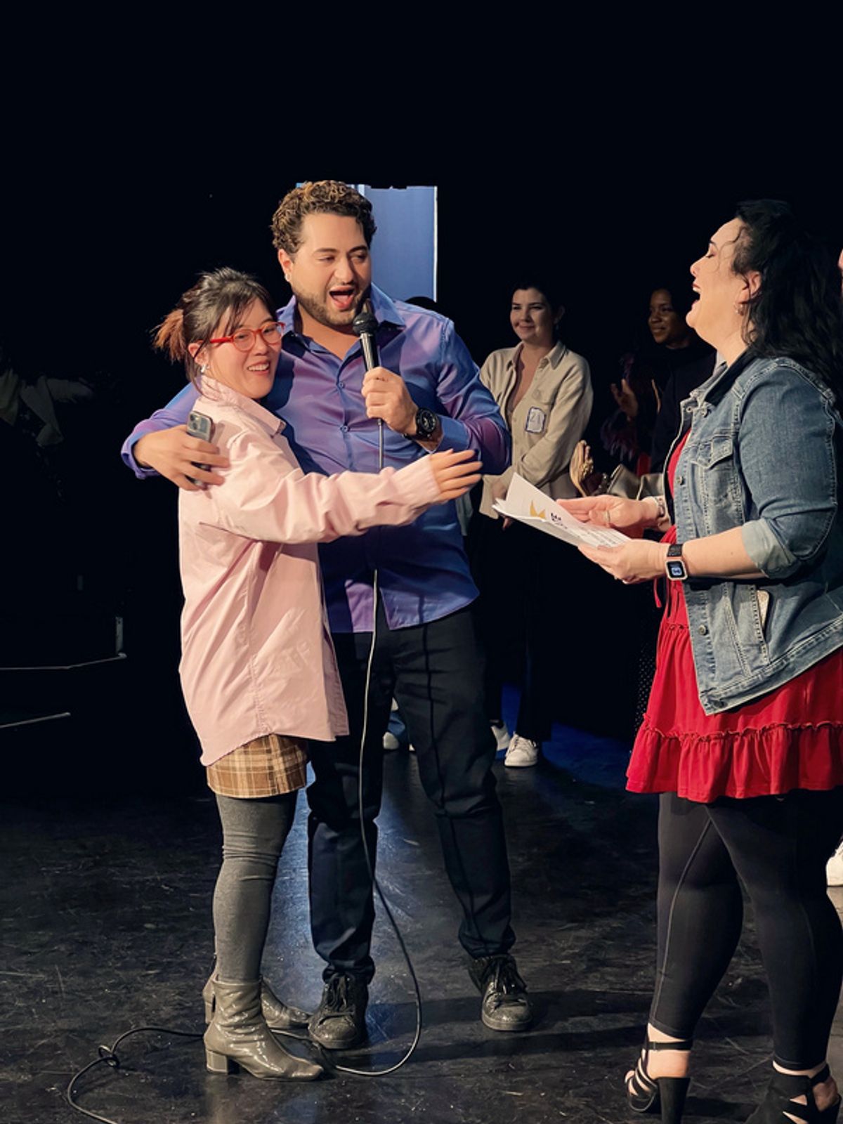 Studio Director & Actor Walid Chaya awards a prize to one of the lucky raffle winners at the ''Slam''. at 