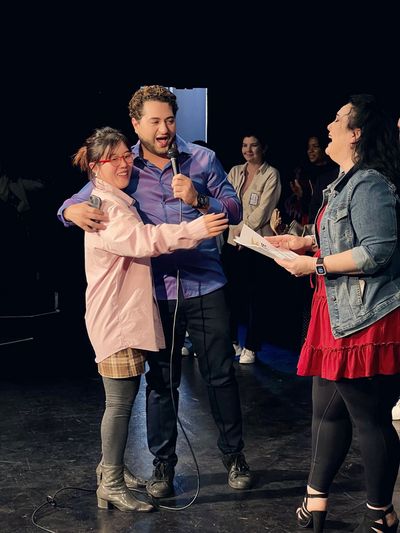 Studio Director & Actor Walid Chaya awards a prize to one of the lucky raffle winners Photo