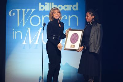 Sylvia Rhone accepts the Executive of the Year Award from Fatima Robinson onstage Photo