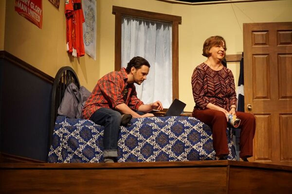 Cheryl (Kathleen Walsh) dreaming of her life as a child with her family while Declan (Braydon Hall) pours over his computer. Photo: Wendy Wagner. at 