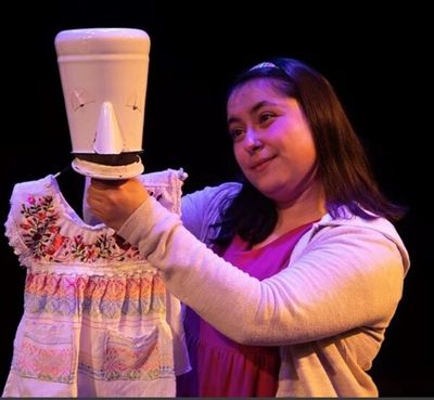 Madison Palomo as "Belinda" using her imagination and puppetry Photo