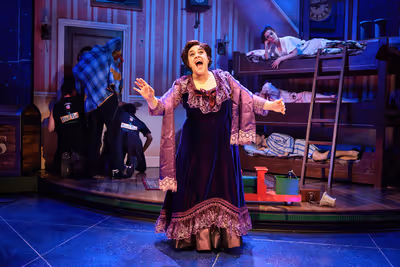 Nancy Zamit (Annie, center) with the cast of Peter Pan Goes Wrong Photo