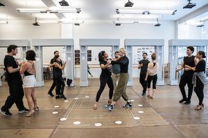 Shereen Pimentel and the company of Evita Photo