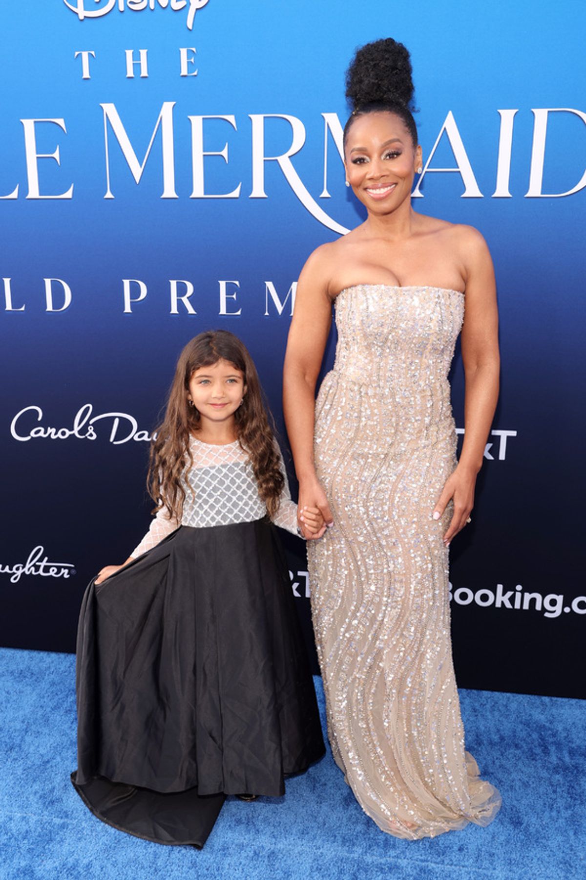 LOS ANGELES, CALIFORNIA - MAY 08: Anika Noni Rose (R) and a guest attend the World Premiere of Disney's live-action feature 'The Little Mermaid' at the Dolby Theatre in Los Angeles, California on May 08, 2023. (Photo by Jesse Grant/Getty Images for Disney) at 