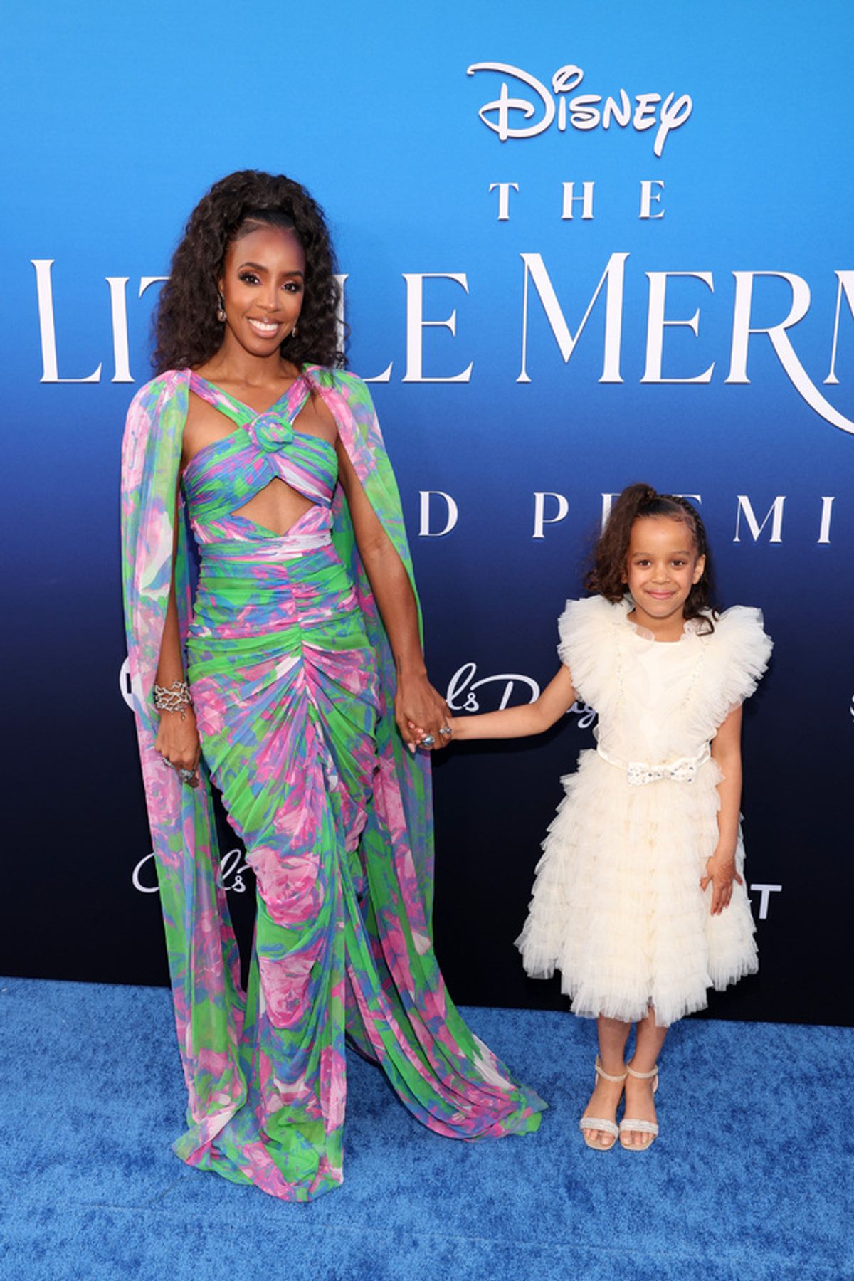 LOS ANGELES, CALIFORNIA - MAY 08: (L-R) Kelly Rowland and a guest attend the World Premiere of Disney's live-action feature 'The Little Mermaid' at the Dolby Theatre in Los Angeles, California on May 08, 2023. (Photo by Jesse Grant/Getty Images for Disney) at 